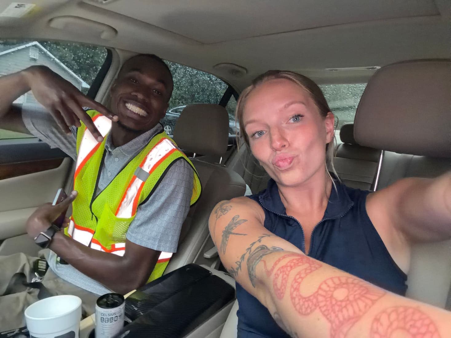 Two team members in a car between calls